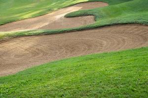 sandpit bunker golf course backgrounds, The sandpit on the golf course fairway is used as a hurdle for athletes to compete photo