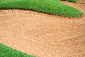 sandpit bunker golf course backgrounds, The sandpit on the golf course fairway is used as a hurdle for athletes to compete photo