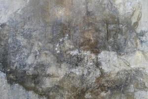 The cement flap surface has scratches, black and white stains, traces caused by plastering to create an artistic pattern photo