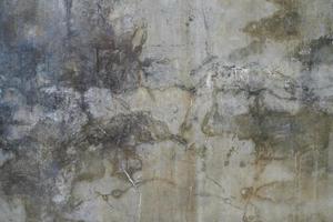 The cement flap surface has scratches, black and white stains, traces caused by plastering to create an artistic pattern photo