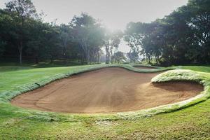 sandpit bunker golf course backgrounds, The sandpit on the golf course fairway is used as a hurdle for athletes to compete photo