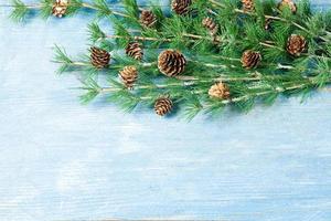 New Year or New Year's Eve background with fir branch with cones. The year 2023 is coming. photo