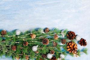 New Year or New Year's Eve background with fir branch with cones. The year 2023 is coming. photo