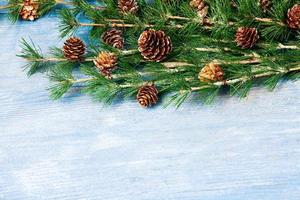 New Year or New Year's Eve background with fir branch with cones. The year 2023 is coming. photo