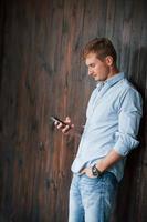 Portrait of man in official shirt that posing for the camera indoors photo