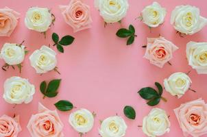 Pink and white roses with its leaves put on pink background with empty space for Valentine day. Flat lay background concept. photo