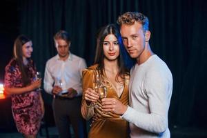 Portrait of lovely couple have party together with their friends photo