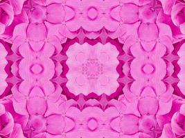 Magenta floral kaleidoscope pattern. Pink flower abstract unique and aesthetic background photo