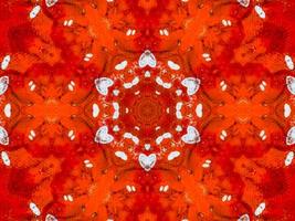 Colorful red fire kaleidoscope background abstract flower and symmetric pattern photo