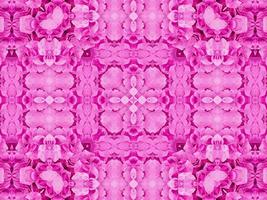 Magenta floral kaleidoscope pattern. Pink flower abstract unique and aesthetic background photo