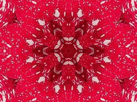 Red floral kaleidoscope background abstract unique and symmetric pattern for christmas vibes photo