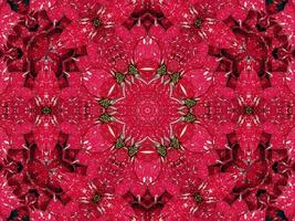 fondo de caleidoscopio floral rojo abstracto patrón único y simétrico para vibraciones navideñas foto