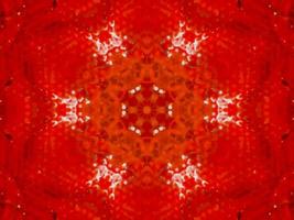 Colorful red fire kaleidoscope background abstract flower and symmetric pattern photo