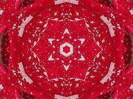 Red floral kaleidoscope background abstract unique and symmetric pattern for christmas vibes photo