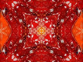 Colorful red fire kaleidoscope background abstract flower and symmetric pattern photo