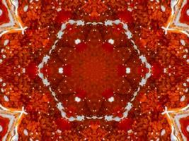 Fondo de caleidoscopio de fuego rojo colorido flor abstracta y patrón simétrico foto