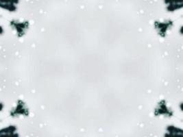 Blurry green leaves kaleidoscope background abstract flower and symmetric pattern for christmas vibes photo