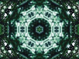 Blurry green leaves kaleidoscope background abstract flower and symmetric pattern for christmas vibes photo