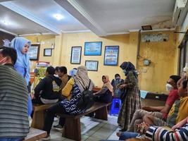 Central Java, Indonesia in October 2022. Several people are queuing and waiting at the BPKB service office or vehicle certificate of ownership at the Jepara Police photo