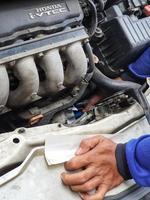 Central Java, Indonesia in October 2022. An officer is carrying out a physical check of a vehicle that will extend or replace its license plate number. photo