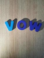 The arrangement of blue letters that read VOW photo