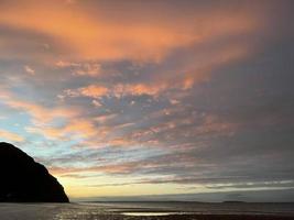 A unique array of colours emblazon the clouds in this beautiful sunset photo