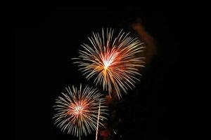 Abstract colored firework background light up the sky with dazzling display photo