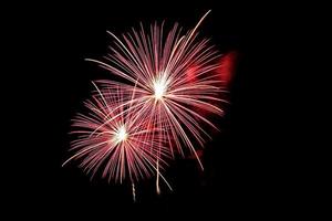 Abstract colored firework background light up the sky with dazzling display photo