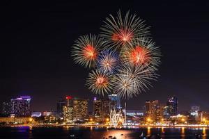 Abstract colored firework background light up the sky with dazzling display photo