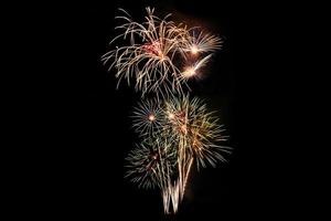 Abstract colored firework background light up the sky with dazzling display photo