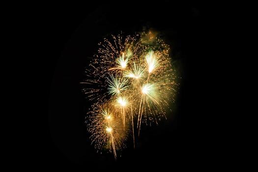 Abstract colored firework background light up the sky with dazzling display photo