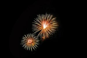 Abstract colored firework background light up the sky with dazzling display photo