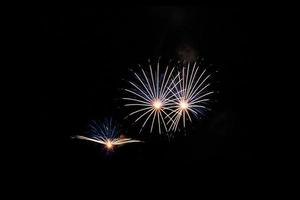 Abstract colored firework background light up the sky with dazzling display photo