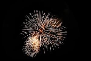 Abstract colored firework background light up the sky with dazzling display photo