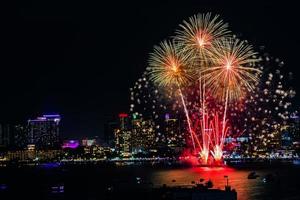 Abstract colored firework background light up the sky with dazzling display photo