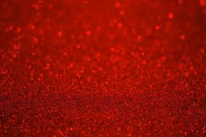 Red glitter background. Red glitter particle texture. photo