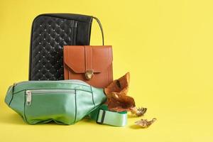 brown, black and green eco leather bags and mushrooms on a yellow background, vegan leather photo