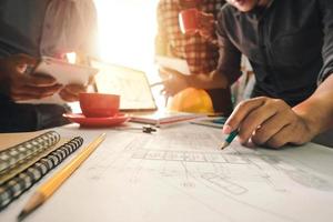 Confident team of architect working together in a office.Then discussing about new startup project on desk.in office, architectural concept photo