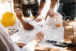 Confident team of architect working together in a office.Then discussing about new startup project on desk.in office, architectural concept photo