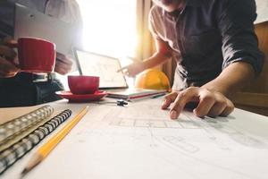 Confident team of architect working together in a office.Then discussing about new startup project on desk.in office, architectural concept photo