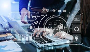 Business team working virtual modern smartphone to reduce CO2 emissions carbon footprint climate change to limit global warming.Sustainable development and green business concept. photo