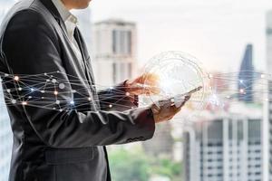 Businessman using smart devices for Digital technology connection and marketing, global internet network and cloud computing concept photo