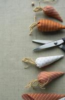 Easter needlework, sewing tools, thread, scissors,  fabric carrots, decor for decorating the house for Easter. Space for text. photo