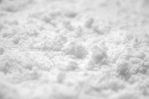 vista de ángulo alto de fondo de textura de nieve blanca foto