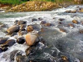 the river flow is calm and clean photo