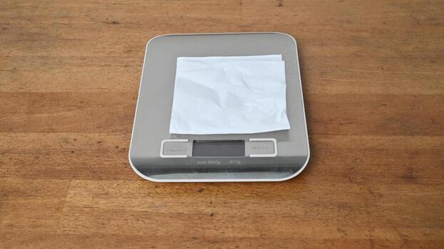 gray empty scales with electronic display stands on wooden table. Close up view photo
