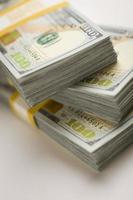 Stacks of Newly Designed One Hundred Dollar Bills photo