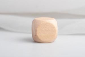Empty wooden dice stacked on gray background photo