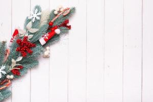 Christmas composition made from pine tree, snowflakes and festive decorations top view. Xmas flat lay. Copy space photo