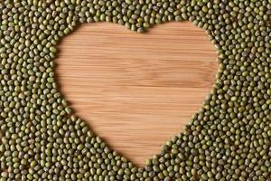 Uncooked Mung Bean in a Heart Shape photo